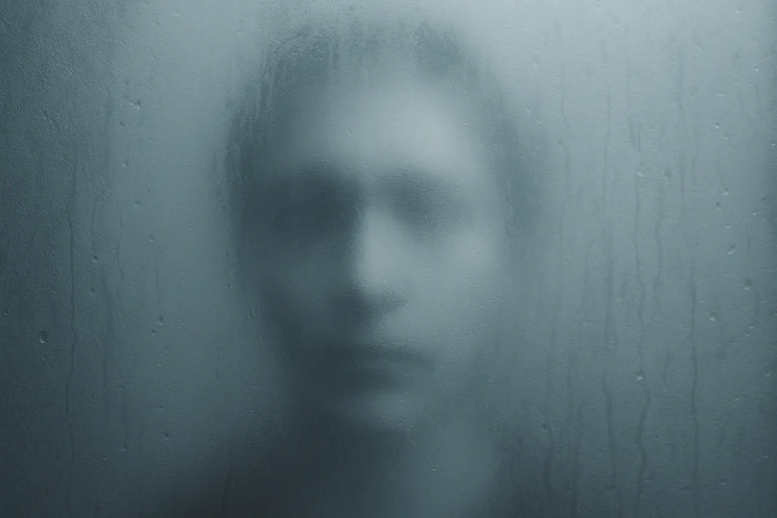 Emotional Abuse and the Loss of Self-Awareness Faded reflection in a foggy mirror symbolizing hidden emotional abuse and self-doubt