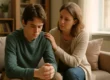 Parent comforting their anxious teenager in a warm, softly lit living room, symbolizing support and empathy