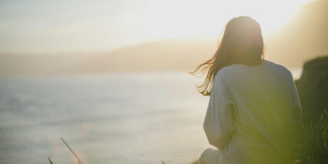 from-shock-to-acceptance-your-guide-to-the-stages-of-trauma-recovery-image trauma stage recovery journey person looking toward bright horizon