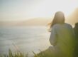 trauma stage recovery journey person looking toward bright horizon